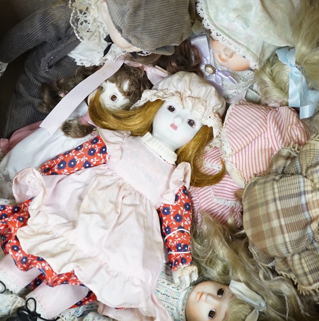 A quantity of various dolls